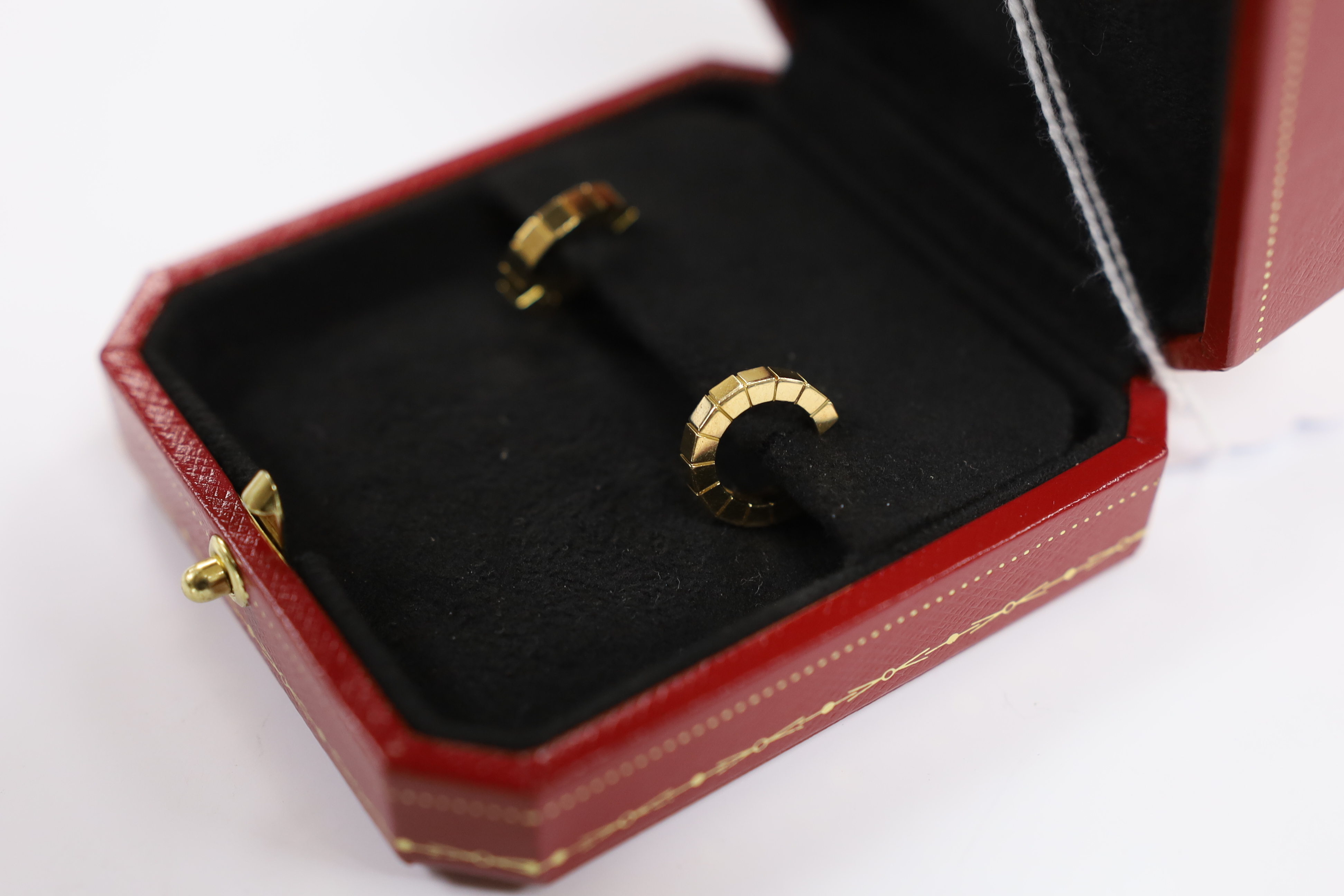 A modern pair of 750 Cartier hoop earrings, signed and numbered FK7259, 14mm, 7.1 grams, with Cartier box.